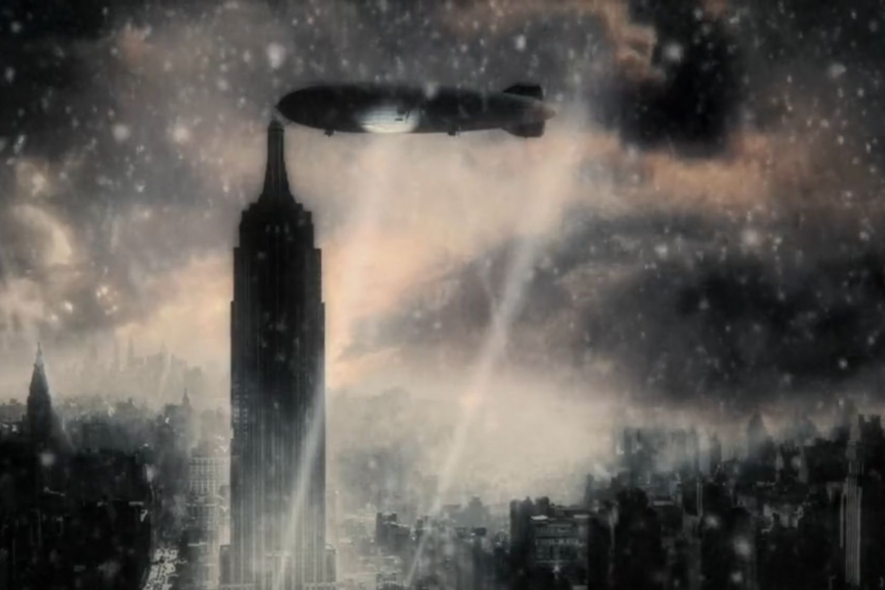 A zeppelin docks at the Empire State Building on a dark snowy night. Searchlights cut through the air.